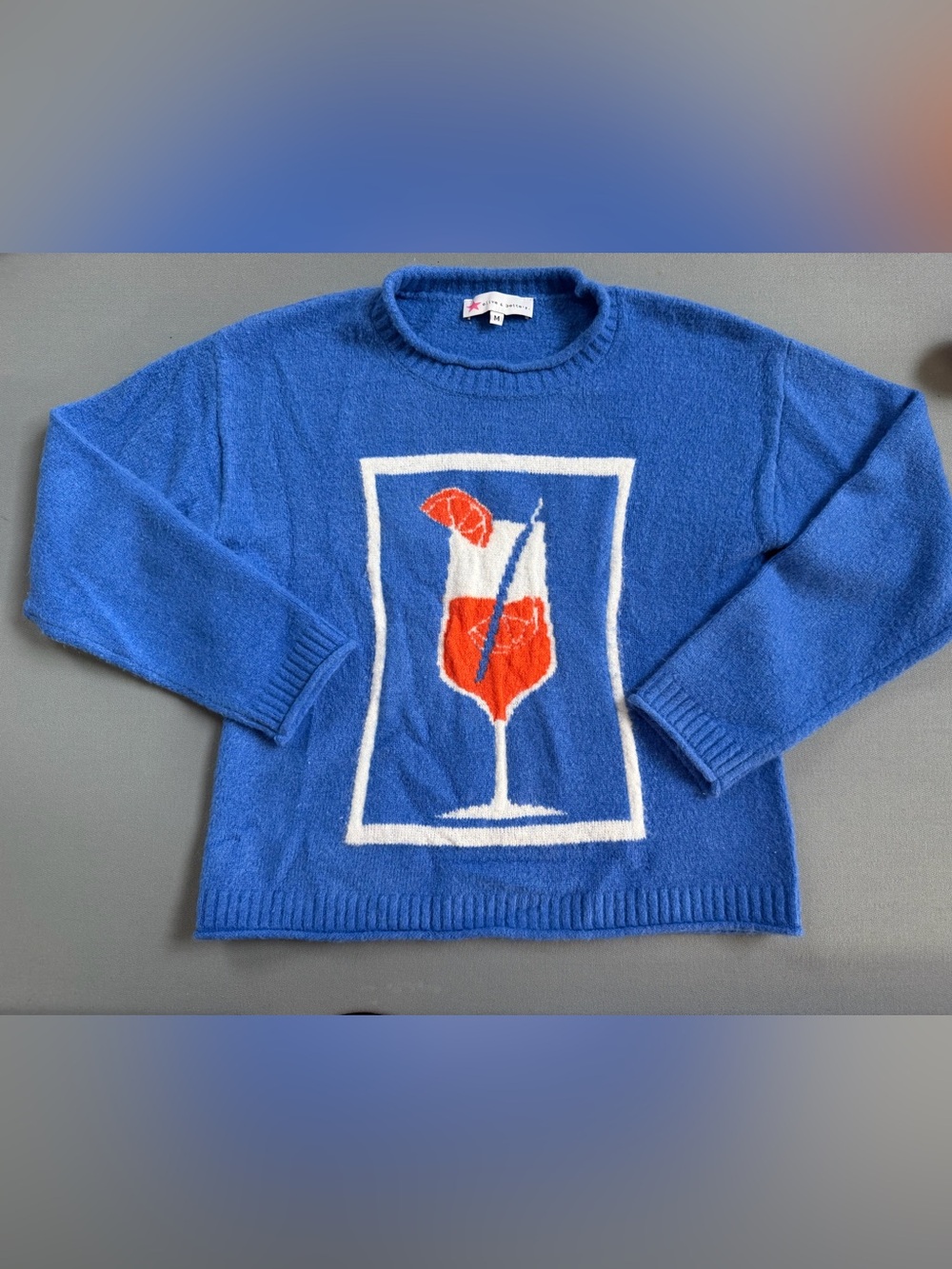 Olive & Bette’s Blue Crewneck Sweater with Orange Cocktail Graphic medium